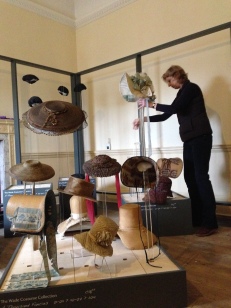Costume Curator, Althea Mackenzie, installing the Hats & Bonnets for 'A Thousand Fancies' at Berrington Hall, Until April 30th 2014