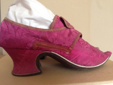 1740s Raspberry silk upper and heel cover, brown leather soles. Charles Paget Wade costume collection, stored at Berrington Hall
