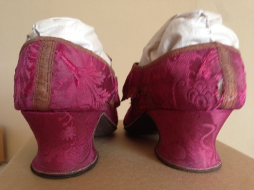 1740s Raspberry silk upper and heel cover, brown leather soles. Charles Paget Wade costume collection, stored at Berrington Hall